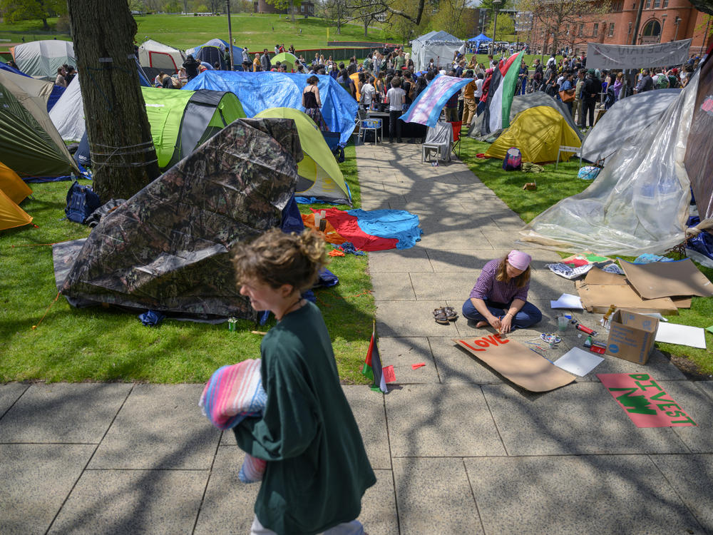 Students create signs at Wesleyan University during a May Day event at their encampment on Wednesday in Middletown, Conn.