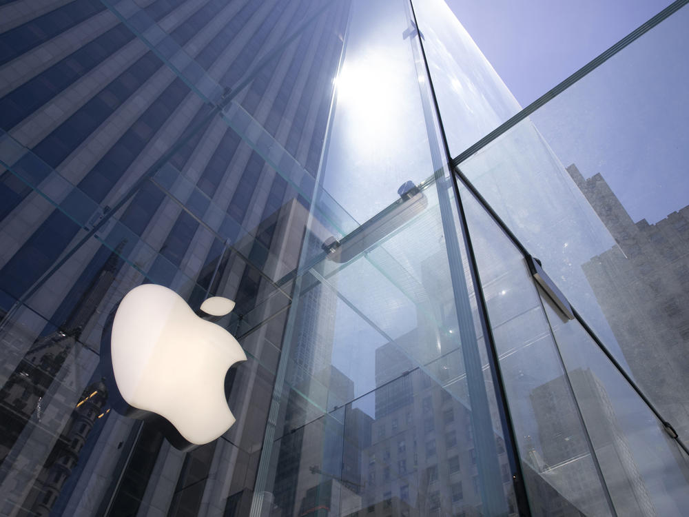 In this June 16, 2020 file photo, the sun is reflected on Apple's Fifth Avenue store in New York.