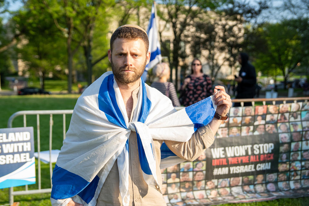 Counterprotester Betzalel, who would not give his last name, wore the flag of Israel at a protest on Case Western Reserve University's campus on May 2. He said wants peace but Hamas must release the hostages.
