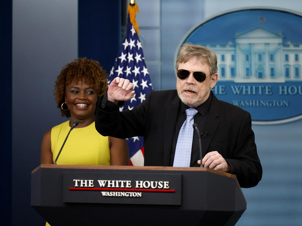 Actor Mark Hamill, wearing a pair of aviator shades he said he got from President Biden, makes a surprise appearance in the White House daily press briefing on May 3.