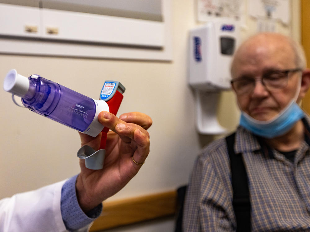 Miguel Divo, a lung specialist at Brigham and Women's Hospital in Boston, holds a metered-dose inhaler. Current versions release a greenhouse gas that's up to 3,000 times as potent as carbon dioxide.