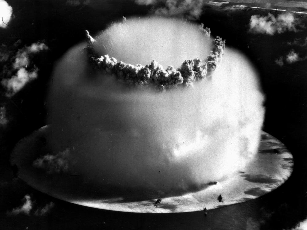 So-called atomic veterans who worked on nuclear weapons tests, like this one from July 25, 1946 file photo above Bikini atoll in the Marshall Islands, are fighting to renew funds that compensate them for health effects from their work.