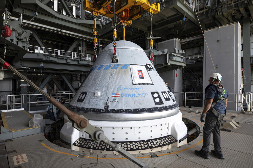 In this photo provided by NASA, the Boeing Starliner spacecraft is lifted for mounting on a United Launch Alliance Atlas V rocket at Cape Canaveral Space Force Station in Florida on Tuesday, April 16, 2024.