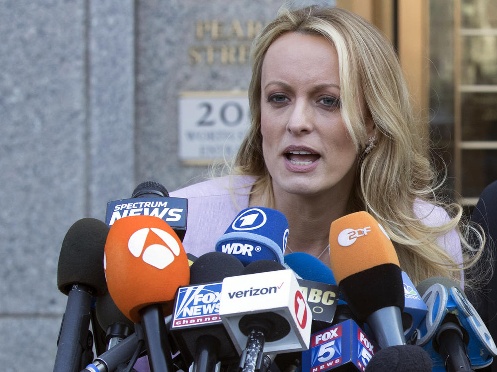 Adult film actress Stormy Daniels speaks outside federal court in New York in April 2018. She is testifying this week in the criminal trial of former President Donald Trump.