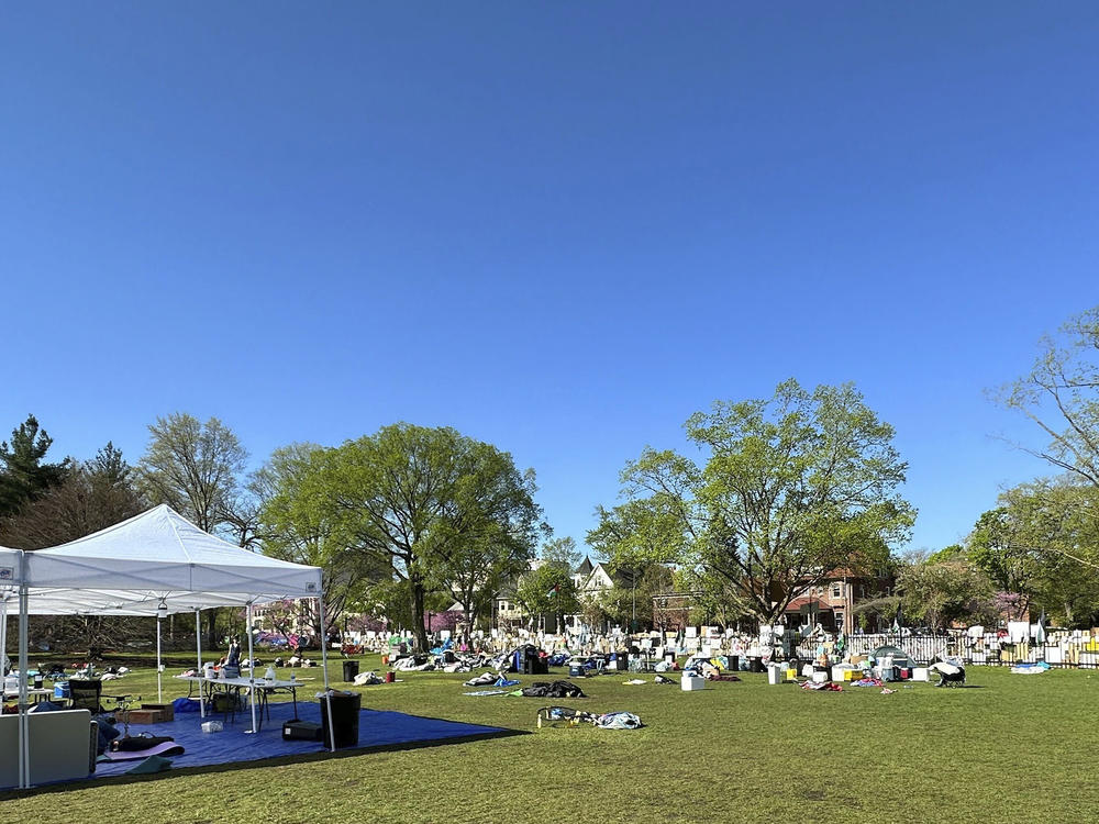 Tents, flags and other supplies remain at Deering Meadow on Northwestern University's campus in Evanston, Ill., on April 30, a day after the university and protest organizers reached an agreement.