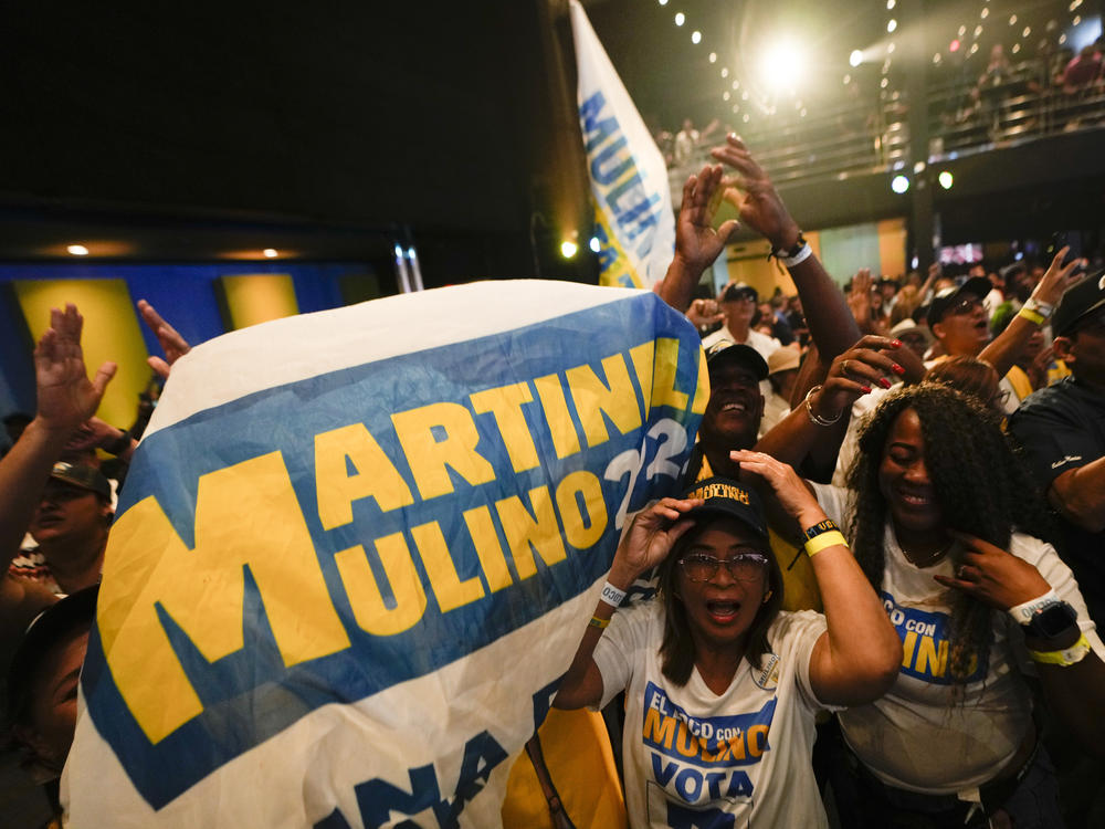 Supporters of Achieving Goals presidential candidate Jose Raul Mulino celebrate early results after the closing of polls for general elections in Panama City, on Sunday.