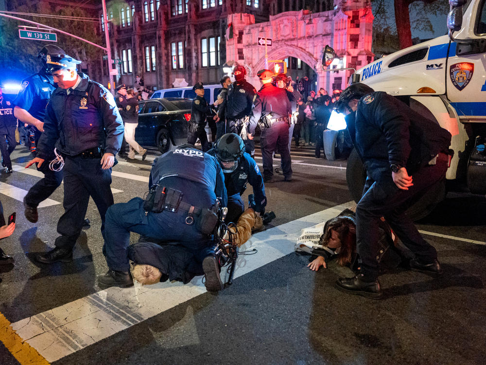 Police arrest protesters during pro-Palestinian demonstrations at The City College Of New York as the NYPD cracks down on protest camps at both Columbia University and CCNY on April 30, in New York City.