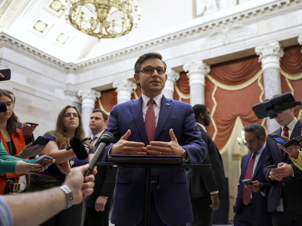 Speaker of the House Mike Johnson speaks with reporters in Statuary Hall after meeting with Reps. Marjorie Taylor Greene and Thomas Massie on May 6.