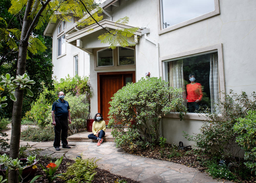 Sonya Pelia (right), her husband Mathew Lutzker (left) and their daughter Jasleen Pelia-Lutzker in Menlo Park, Calif., in May 2020. 