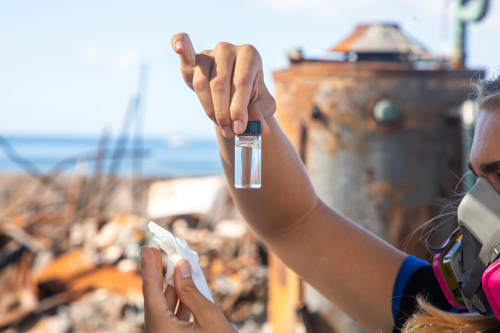 Christiane Keyhani checks water quality in downtown Lahaina. 