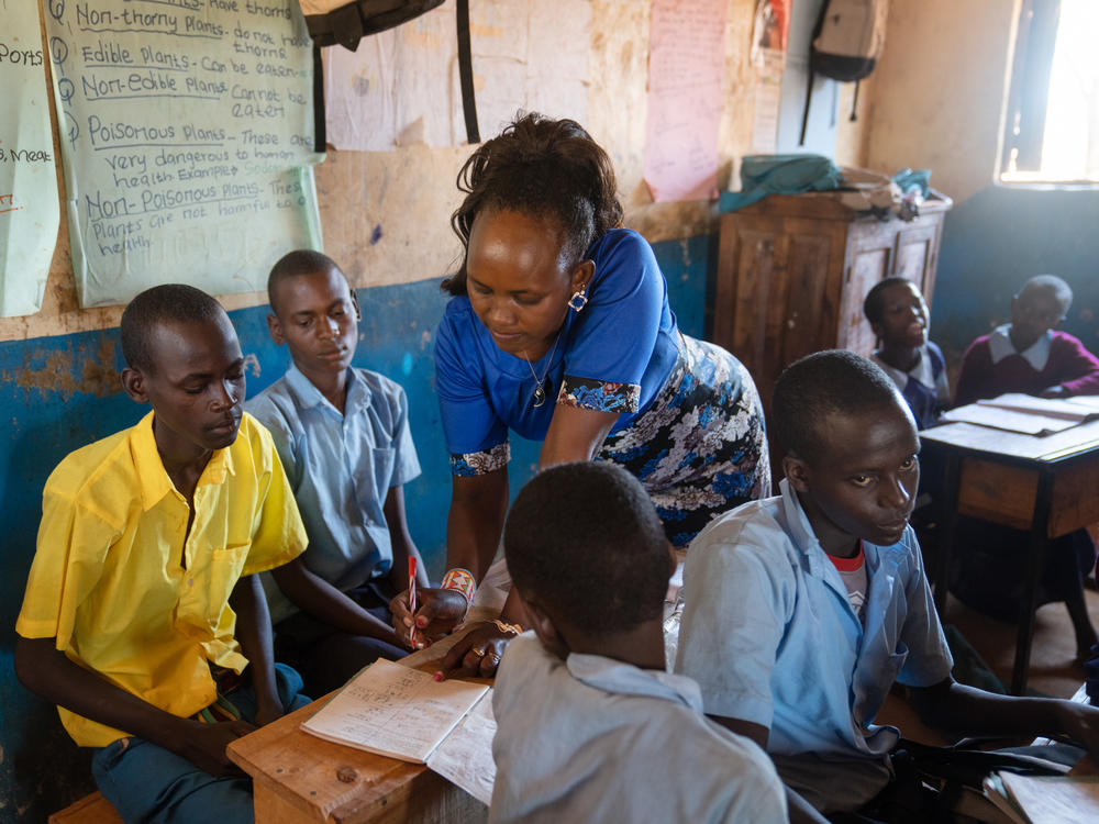 Teacher Florence Lerapayo grades the assignments done by the moran boys. She says they have an enormous amount of catching up to do. But she's also confident that it's not too late for them.