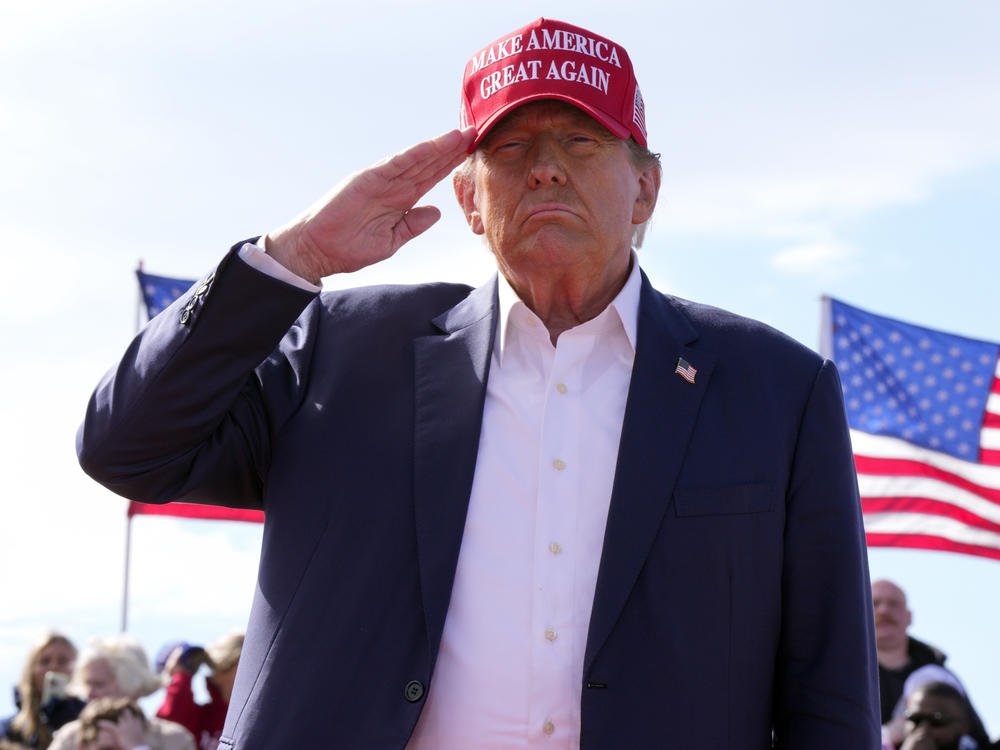 Former President Donald Trump, the Republican presidential candidate, salutes at a campaign rally on March 16 in Vandalia, Ohio.