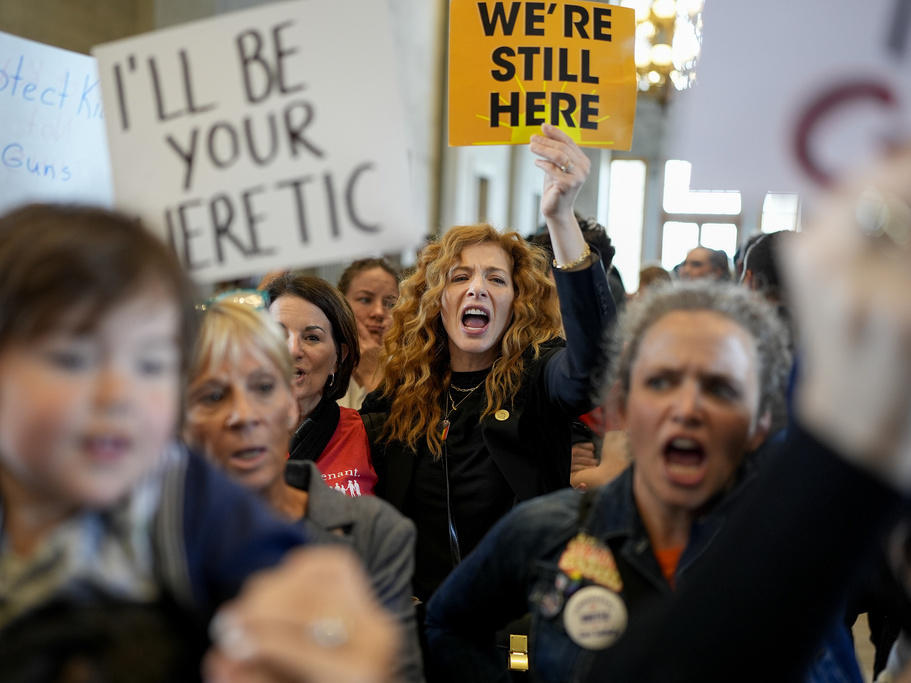 People protest outside the House chamber after legislation passed that would allow some teachers to be armed in schools during a legislative session Tuesday, April 23, 2024, in Nashville, Tenn.
