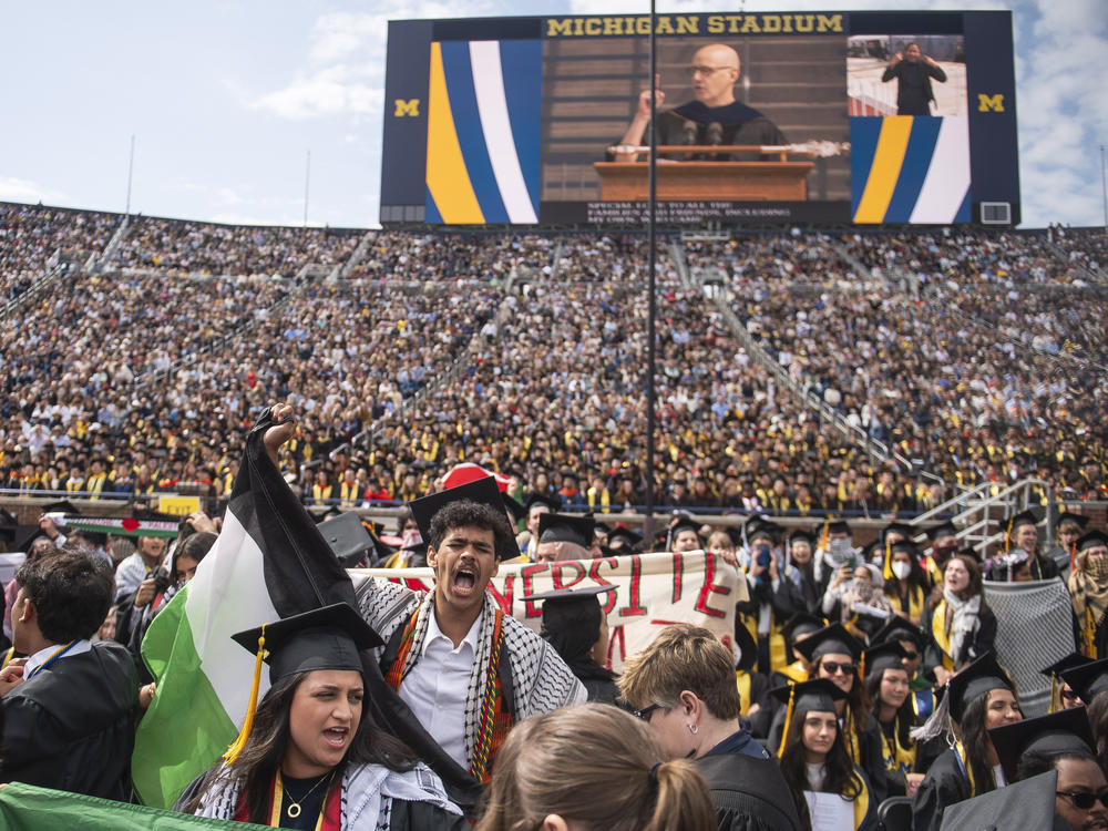 Graduates chant in support of Palestinians during the University of Michigan's commencement ceremony at Michigan Stadium in Ann Arbor on Saturday.