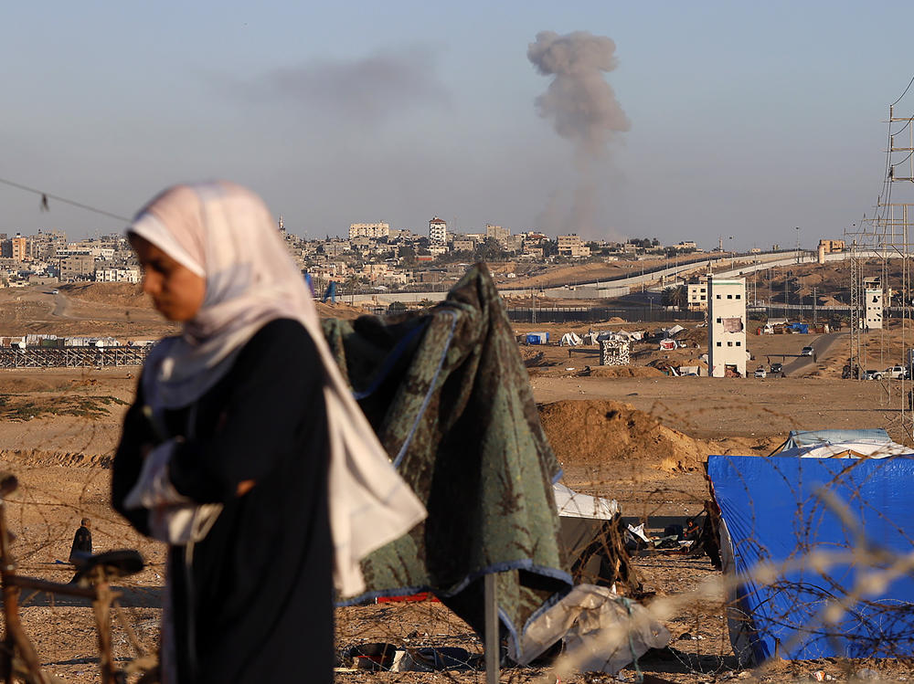 Smoke rises following an Israeli airstrike on buildings near the separating wall between Egypt and Rafah, southern Gaza Strip, on Monday.
