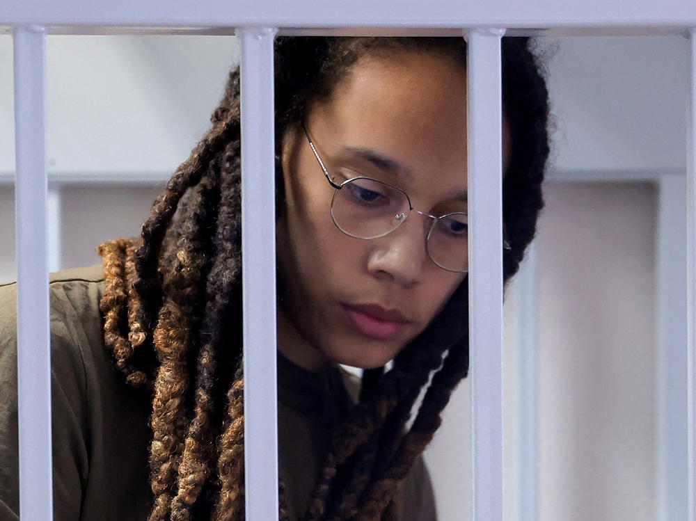 Brittney Griner stands in a defendants' cage before a court hearing in Khimki, Russia, on Aug. 2, 2022.