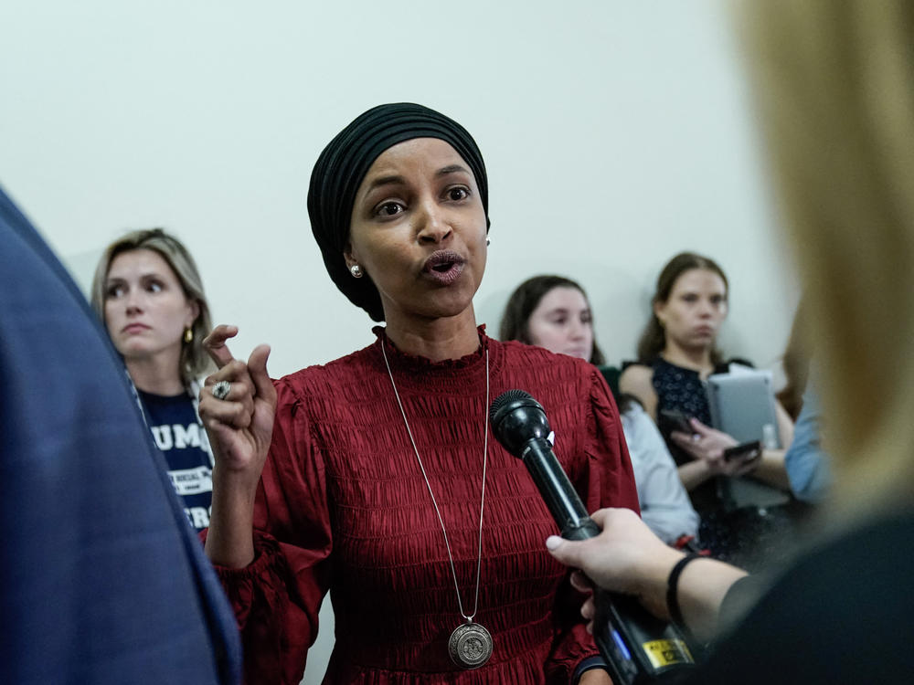 Rep. Ilhan Omar, Democrat of Minnesota, speaks to reporters in the hallway outside a House Committee on Education and the Workforce hearing 