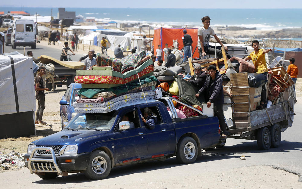 Hundreds of Palestinians leave eastern Rafah for the coastline of Deir al-Balah after the Israeli army announced it has taken control of the Palestinian side of the Rafah border crossing, in the Gaza Strip, Tuesday.