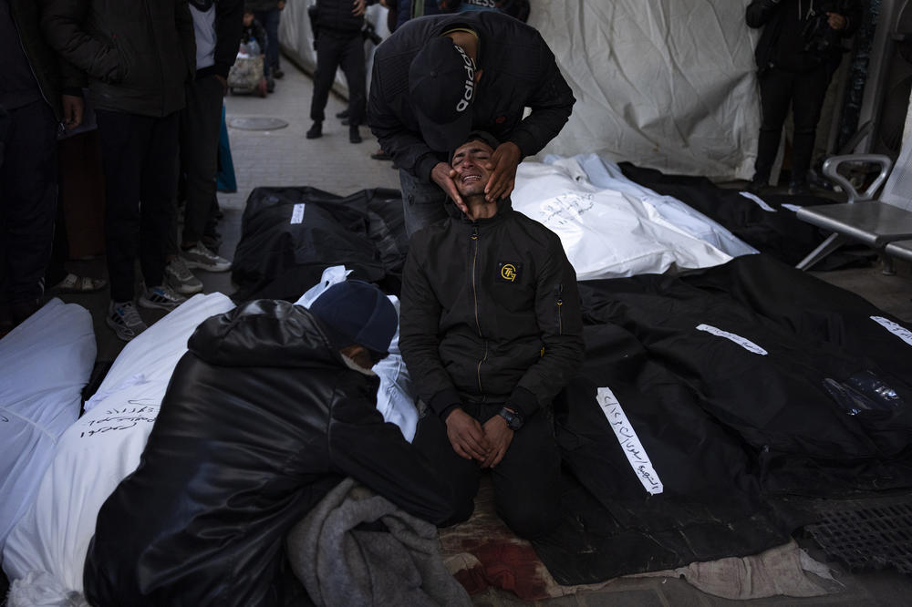 Palestinians mourn relatives killed in the Israeli bombardment of the Gaza Strip, at a hospital morgue in Rafah, Feb. 12. The Israeli military said that it had rescued the two hostages from captivity in the Gaza Strip while conducting the airstrikes.