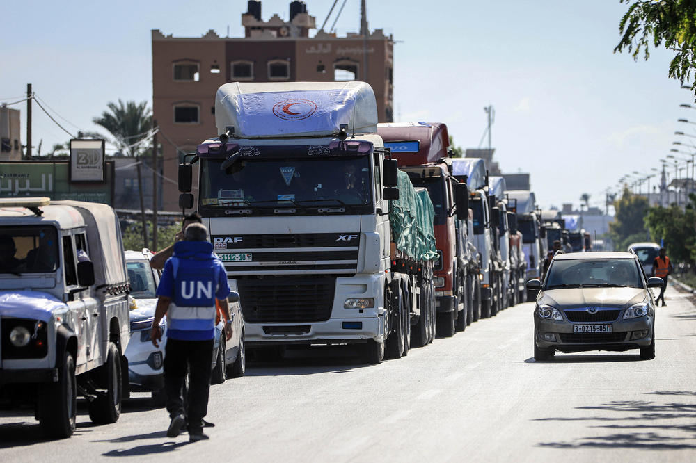The first trucks carrying humanitarian aid head to Deir Al-Balah after crossing from Egypt into the Gaza Strip in Rafah, on Oct. 21, 2023.