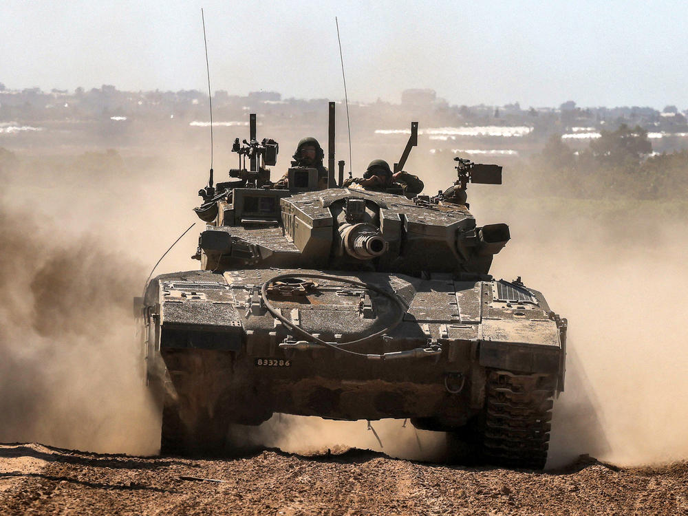 An Israeli army battle tank moves along the border with the Gaza Strip in southern Israel on May 7.