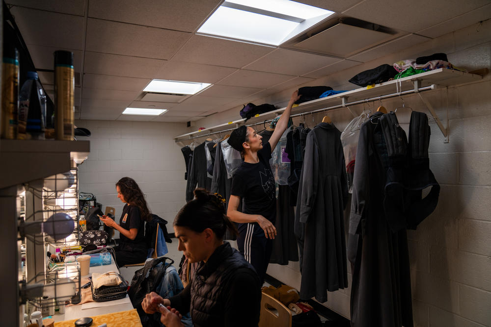 Some of the corps dancers get ready for the dress rehearsal of <em>Turandot</em>.