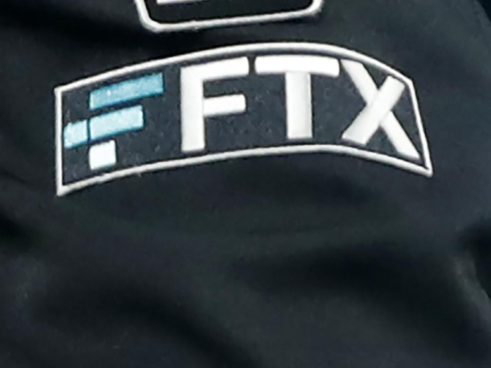 The FTX logo appears on home plate umpire Jansen Visconti's jacket at a baseball game with the Minnesota Twins on Sept. 27, 2022, in Minneapolis.