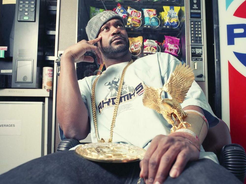 Ghostface Killah wearing his iconic gold eagle cuff.