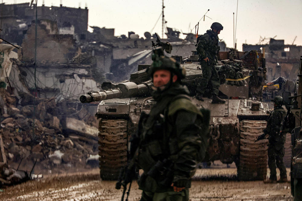 This photo taken during a media tour organized by the Israeli military on Jan. 27 shows Israeli soldiers patrolling an area in Gaza's main southern city of Khan Younis, amid continuing battles between Israel and Hamas.
