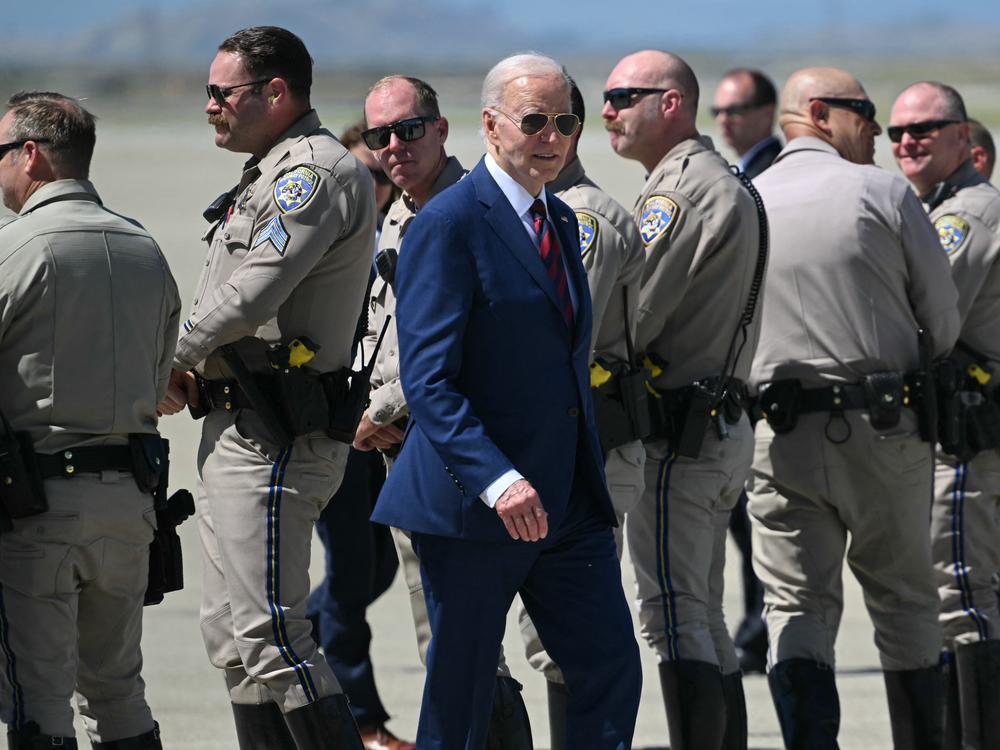 President Biden makes his way to Air Force One after posing with highway patrol troopers in Mountain View, Calif., on May 10.