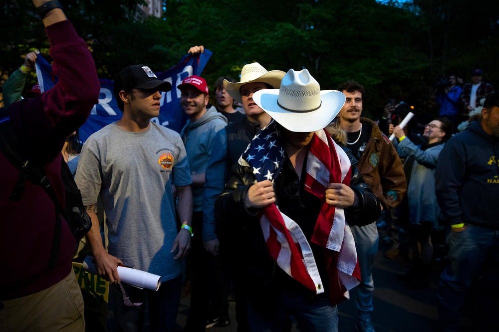 Following a talk by Turning Point USA founder Charlie Kirk, supporters clashed with University of Washington students and protesters who barricaded the east entrance to the encampment for Palestine on the Quad on Tuesday, May 7, 2024, in Seattle.