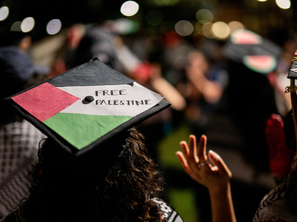 Graduate students and demonstrators at the University of Texas at Austin protest the war in Gaza after walking out of commencement at the DKR-Texas Memorial Stadium on May 11, 2024 in Austin.
