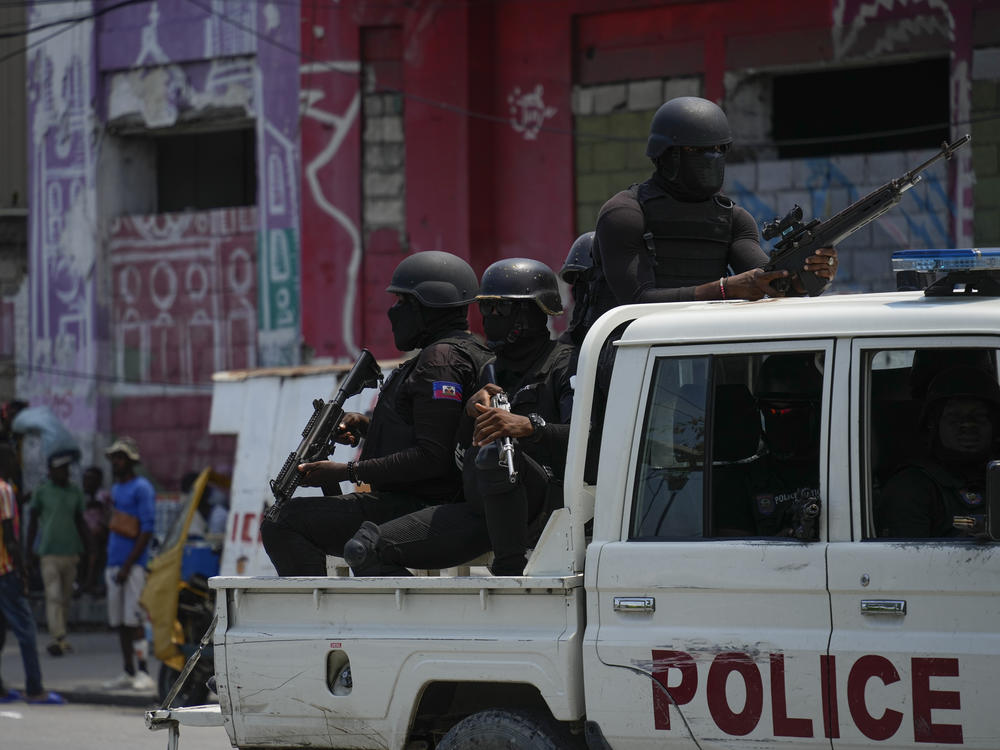 Police patrol the Champ de Mars area of Port-au-Prince, Haiti, April 24.