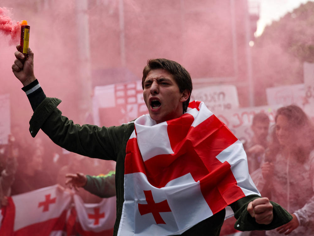 The Georgian parliament is scheduled to vote on the controversial law on Tuesday. Here, a demonstrator on Monday in Tbilisi, Georgia.