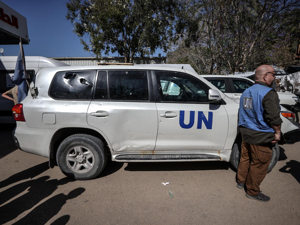 A damaged United Nations vehicle is seen in front of a hospital in the Gaza Strip after a U.N. employee was killed in an attack on Monday.