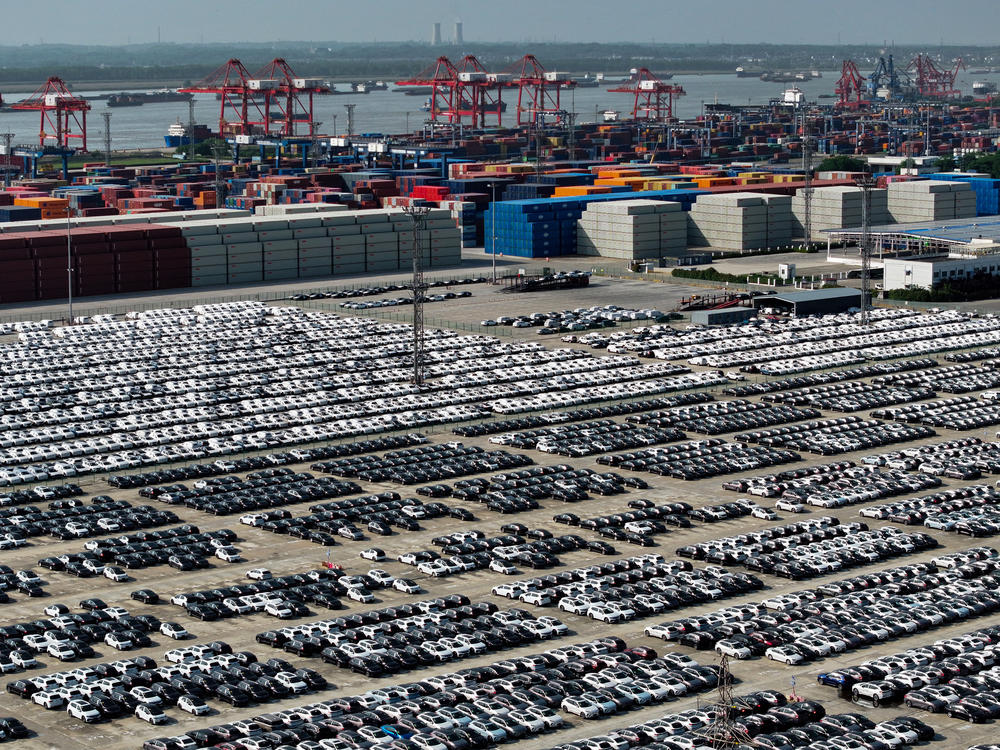 China is aiming to become a global automotive powerhouse, particularly when it comes to electric vehicles. Here, cars wait to be loaded onto a ship at a port in Nanjing.