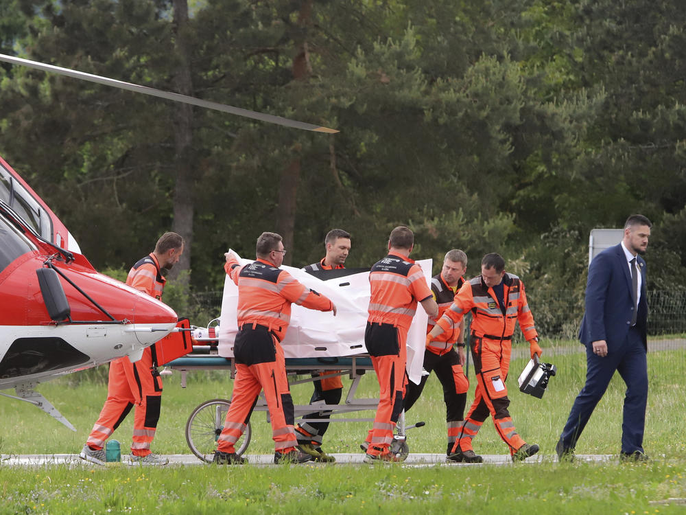 Rescue workers wheel Slovak Prime Minister Robert Fico, who was shot and injured, to a hospital in the town of Banska Bystrica, central Slovakia, on Wednesday.