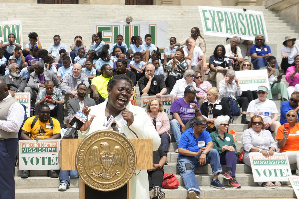 Azia Wiggins, an organizer with Working Together Mississippi, opens the Mississippi Medicaid Expansion Rally at the Mississippi State Capitol in Jackson, with a song, Tuesday, April 16, 2024.