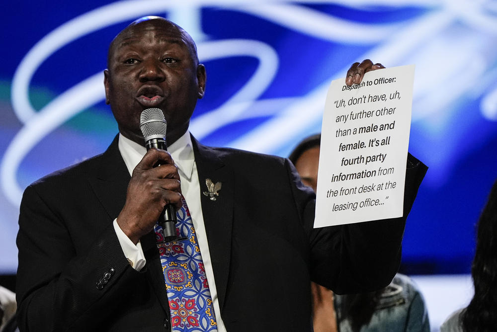 Trial lawyer Benjamin Crump speaks Thursday in Stonecrest, Ga., as the family of slain Airman Roger Fortson look on during a news conference describing details of the airman's death.