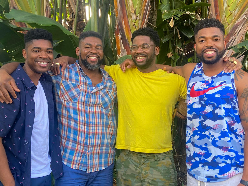Honoré Prentice (in yellow shirt and glasses), who lives in Canada, met three of his birth siblings, who live in the U.S., in person on Dec. 13, 2021. The brothers were all born in Haiti.