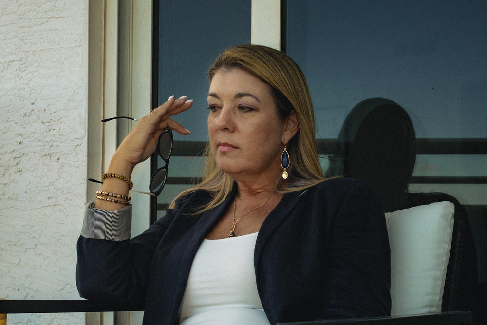 Rogozinski sits on the patio of her apartment.