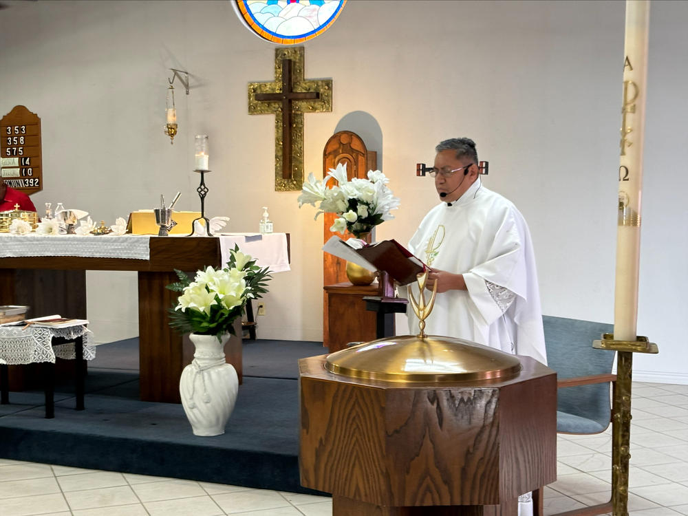 Pastor Julio Vasquez reads from the altar of the Iglesia Luterana San Lucas in Eagle Pass, Texas during a Sunday service on April 7, 2024.