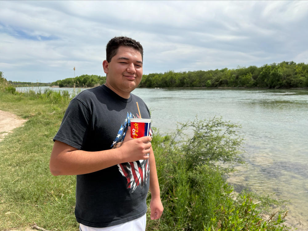 Rashaan Soto, 19, poses in front of a section of the Rio Grande in Eagle Pass, Texas on April 6,. 2024.
