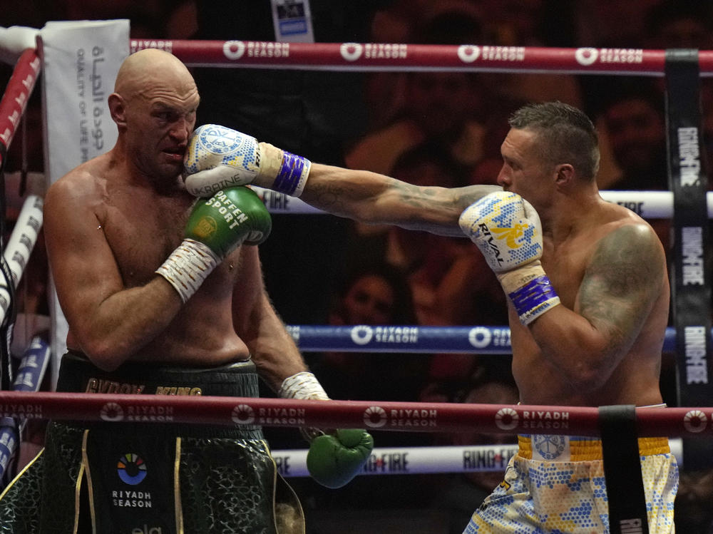 Britain's Tyson Fury, left, and Ukraine's Oleksandr Usyk trade blows during their undisputed heavyweight world championship boxing fight at the Kingdom Arena in Riyadh, Saudi Arabia, Sunday, May 19, 2024.