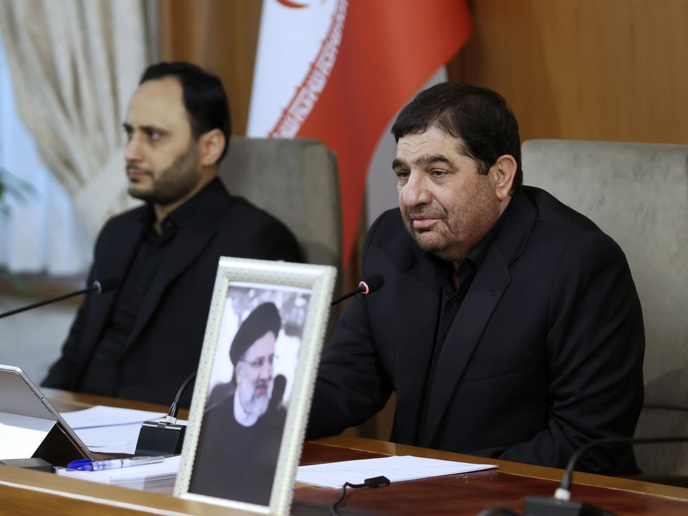 In this photo released by the Iranian first vice president's office, Iranian First Vice President Mohammad Mokhber, right, now acting President of the Islamic Republic of Iran, leads a cabinet meeting in Tehran on Monday.
