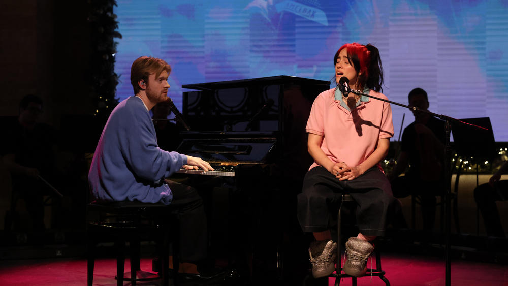 Billie Eilish, accompanied by Finneas.