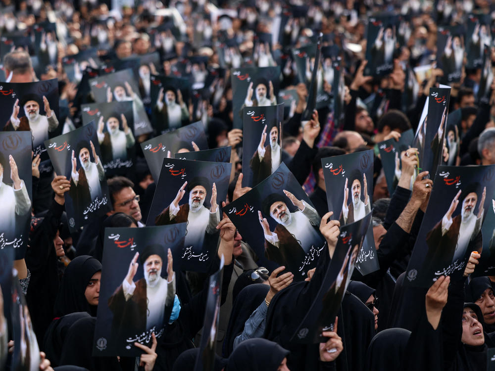 Iranians gather at Valiasr Square in central Tehran to mourn the death of President Ebrahim Raisi and Foreign Minister Hossein Amirabdollahian in a helicopter crash.