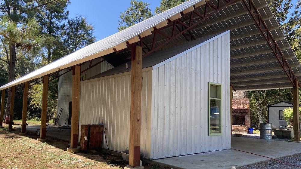 Auburn University's Rural Studio built Reggie Walker's home so the main roof doesn't touch the rest of the housing structures.