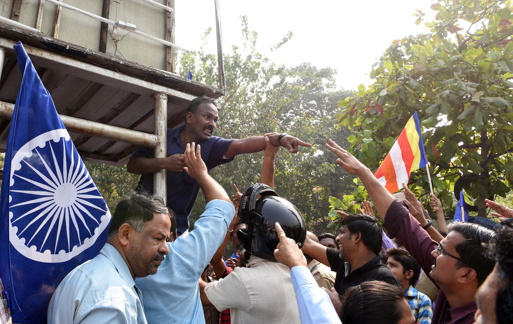 Dalit activists argue with a police officer during a protest on Western Express Highway in Mumbai on Jan. 4, 2018.