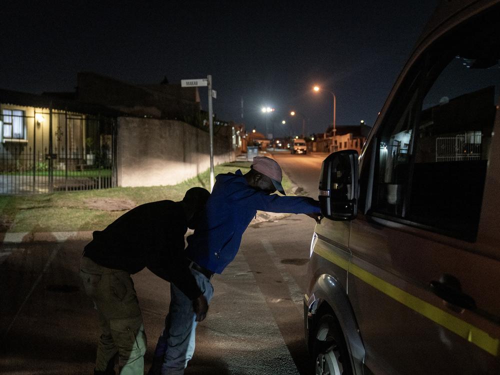 A Gauteng Traffic Warden searches a man during an operation with members of Growing Gauteng Together 2030 as they search for illegal firearms and drugs in Diepkloof, Soweto, South Africa, on April 26. The recently established GGT2030 is an alliance of multiple private security companies working together to support the South African Police Services in their efforts to combat crime. 